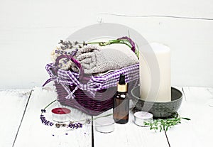 Dry lavender and oil on a white wooden table