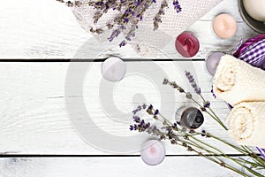 Dry lavender and oil on a white wooden table