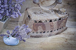 Dry lavender and old rustic rustic iron on rustic table