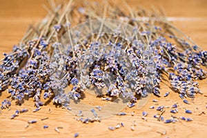 Dry lavender seeds on wooden background