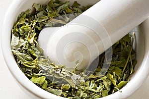 Dry leaves in a bowl close up