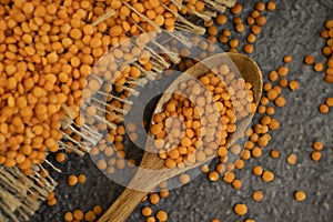Dry lentils spoon on wooden food nutrition   consumption