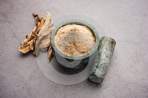 Dry mango powder is an indian spice amchoor with raw dried fruit