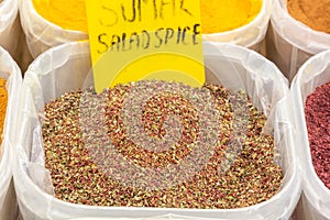 Dry mix of various herbs and salad spices is sold at a street bazaar.