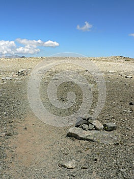 Dry moonscape with blue sky