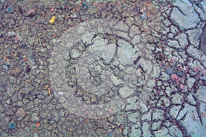 Dry mud ground, crack texture, granite gravel. Dry dirty soil. Cracks on clay