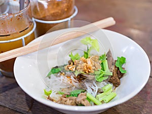 Dry noodle with beef stew in local shop at Bangkok, Thailand