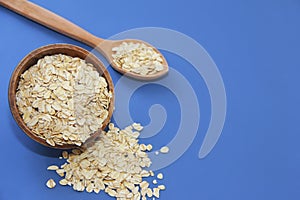 Dry oat flakes in a plate for dietary nutrition