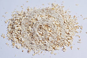 Heap oatmeal on a white background