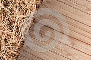 Dry old hay with old rustic wooden floor top view