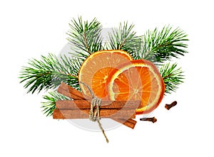 Dry orange, cinnamone, cloves and green pine twigs in a Christmas arrangement photo