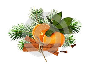 Dry orange, tangerine, cinnamone, cloves and green pine twigs in a Christmas arrangement photo
