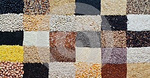 Dry organic cereal and grain seeds background in brick wall pattern
