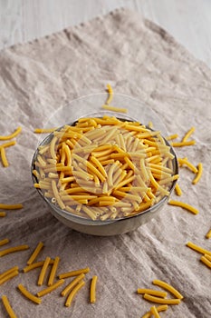 Dry Organic Maccheroni Pasta in a Bowl, side view