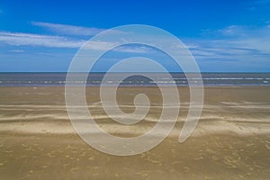 Dry over wet sand and waves in Cassino beach