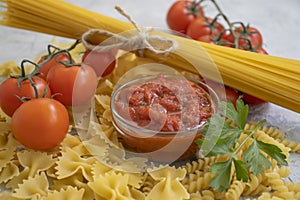 Dry pasta, tomato   fresh  concept ingredient meal  nutrition cooking board  dinner  natural vintage