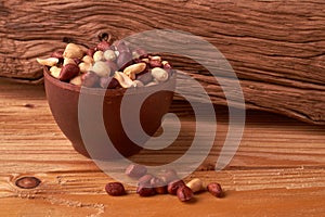 dry peanuts background. close up dry peanuts in clay bowl. Space for pext. Copyspace