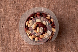 dry peanuts background. close up dry peanuts in clay bowl. Space for pext. Copyspace