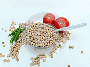 Dry peas with tomato and green chilies  on white background.