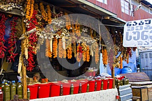 Dry pepper and other paces hanging in the outdoor market