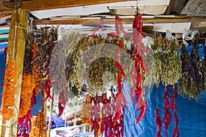 Dry pepper and other paces hanging in the outdoor market