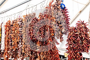 Dry peppers hanging on a market