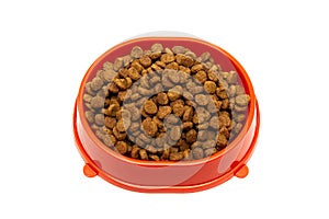 Dry pet food in a bowl on a white background