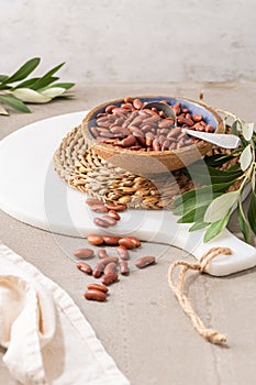 Dry raw butter beans in a bowl on a kitchen countertop. Cooking Healthy Food photo