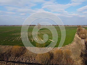 Dry reclamation canal in the field, aerial view. Agricultural landscape