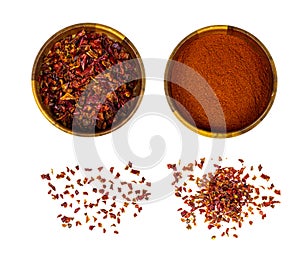 Dry red chili pepper slices and powder in round wooden bowl set isolated on white background.