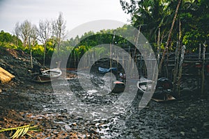 Dry river in the forest, boats on the ground