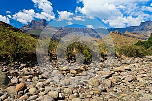 Dry riverbed with mountains in the background