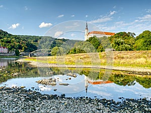 Dry riverbed of river Elbe in Decin, Czech Republic. Castle above old railway bridge
