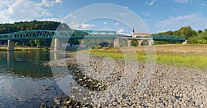 Dry riverbed of river Elbe in Decin, Czech Republic. Castle above old railway bridge