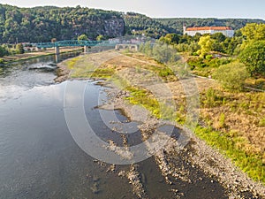 Dry riverbed of river Elbe in Decin, Czech Republic. Castle above old railway bridge