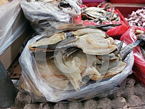 Dry salted cod fish display at traditional market photo