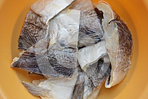 Salted cod hydrating on water