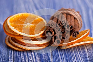 Dry slices of orange and cinnamon sticks. Macro