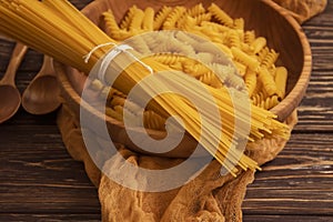 Dry spaghetti on wooden background various  preparation   delicious  cuisine pasta nutrition uncooked
