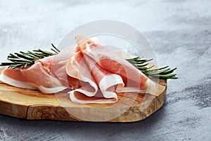 Dry Spanish ham, Jamon Serrano, Bellota, Italian Prosciutto Crudo or Parma ham. meat cutting photo