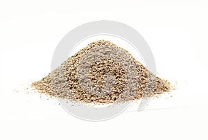 Dry spelt bran pile isolated on white background.