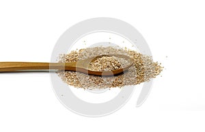 Dry spelt bran pile in a wooden spoon isolated