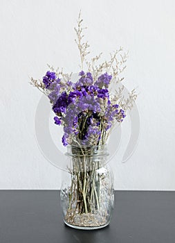 Dry statice flower in glass