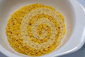Dry stelline (little star) pasta in a small dish photo