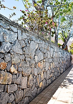 Dry stone wall made of natural stones on the island of Crete in Greece