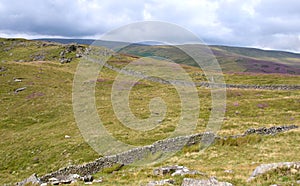 Dry stone walls and high moorland.