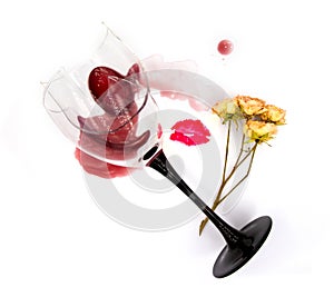 Dry sweet white wine in a broken glass, rose flower and a lipstick kiss isolated on white background. For winery, bar or