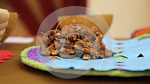 Dry Tamarind fruit in a plate. Harvesting agricultural products.