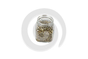 Dry Tansy Herb in latin Tanacetum vulgare in a glass jar isolated on white background. Herbs. Alternative medicine