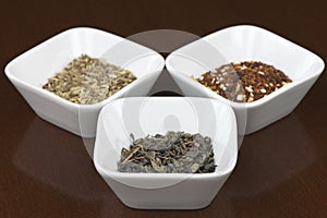 Dry tea leaves in square plates